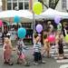 YMCA day campers walk through the Summer Art Fair on Main St. holding colorful balloons as they take in the Ann Arbor Art Fair on Wednesday. Melanie Maxwell I AnnArbor.com